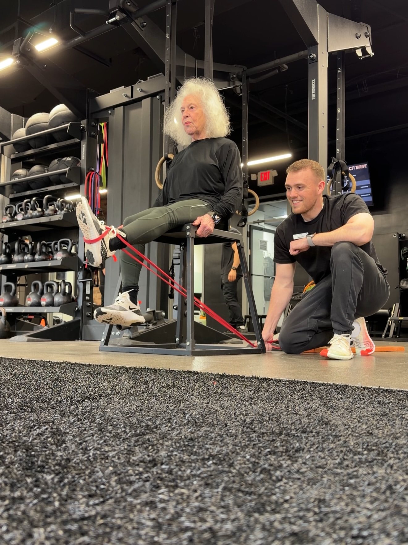 Kevin Rimler coaching a client one-on-one at the gym